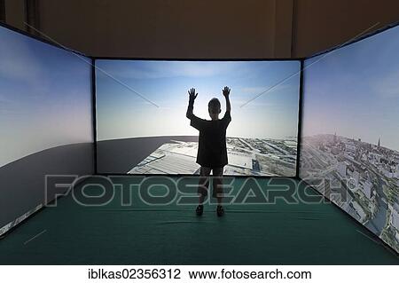 "Child navigating a 3-D city model on projection screens, Cave Automatic Virtual Environment, Ideenpark 2012, technology and education summit conference, Essen, Ruhr area, North Rhine-Westphalia, Germany, Europe" View Large Photo Image Stock Image - "Child navigating a 3-D city model on projection screens, Cave Automatic Virtual Environment, Ideenpark 2012, technology and education summit conference, Essen, Ruhr area, North Rhine-Westphalia, Germany, Europe". Fotosearch