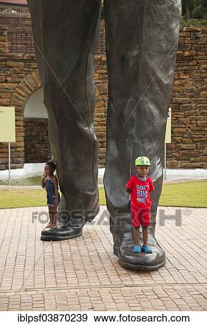 "Children at the feet of the huge Nelson Mandela statue in front of the Union Buildings government buildings, Pretoria, Gauteng, South Africa, Africa" View Large Photo Image Stock Photo - "Children at the feet of the huge Nelson Mandela statue in front of the Union Buildings government buildings, Pretoria, Gauteng, South Africa, Africa". Fotosearch