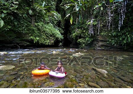 "Children bathing in front of the Millennium Cave, Espiritu Santo, Sanma Province, Vanuatu, Oceania" View Large Photo Image Stock Photography - "Children bathing in front of the Millennium Cave, Espiritu Santo, Sanma Province, Vanuatu, Oceania". Fotosearch