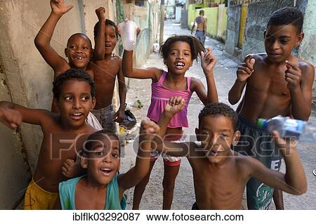 "Children cheering happily in a slum or favela, Jacarezinho favela, Rio de Janeiro, Rio de Janeiro State, Brazil, South America" View Large Photo Image Stock Photo - "Children cheering happily in a slum or favela, Jacarezinho favela, Rio de Janeiro, Rio de Janeiro State, Brazil, South America". Fotosearch