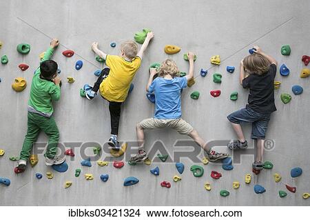 Picture - "Children climbing on a climbing wall, Schriesheim, Baden-Wurttemberg, Germany, Europe". Fotosearch