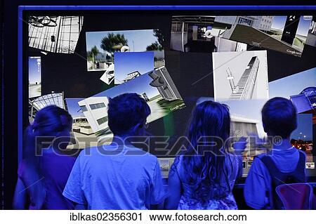 Stock Image - "Children controlling software by touch and gestures, touch screen, Ideenpark 2012, technology and education summit conference, Essen, Ruhr area, North Rhine-Westphalia, Germany, Europe". Fotosearch