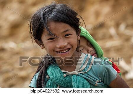 Stock Image - "Children from the Konyak tribe, Songa, Nagaland, India, Asia". Fotosearch