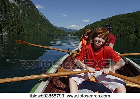 "Children in a rowing boat on lake Konigssee, Berchtesgadener Land district, Upper Bavaria, Bavaria, Germany, Europe" View Large Photo Image Stock Photo - "Children in a rowing boat on lake Konigssee, Berchtesgadener Land district, Upper Bavaria, Bavaria, Germany, Europe". Fotosearch