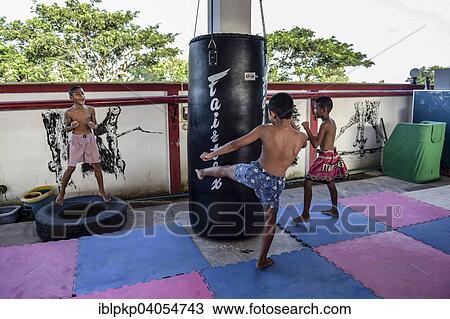 Stock Image - "Children in martial arts training, Hua Hin, Thailand, Asia". Fotosearch