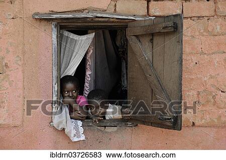 "Children looking out of the window of a house, Bafut, Northwest Region, Cameroon, Africa" View Large Photo Image Stock Image - "Children looking out of the window of a house, Bafut, Northwest Region, Cameroon, Africa". Fotosearch