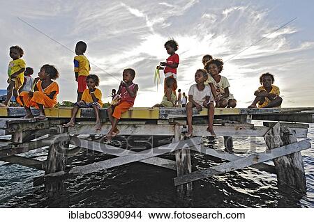 "Children on a jetty, Arborek, Raja Ampat, West Papua, Indonesia, Asia" View Large Photo Image Picture - "Children on a jetty, Arborek, Raja Ampat, West Papua, Indonesia, Asia". Fotosearch