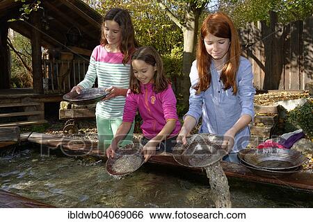 "Children panning for gold, gold panning at Drachenschmiede Flederwisch, Furth im Wald, Upper Palatinate, Bavaria, Germany, Europe" View Large Photo Image Stock Photograph - "Children panning for gold, gold panning at Drachenschmiede Flederwisch, Furth im Wald, Upper Palatinate, Bavaria, Germany, Europe". Fotosearch