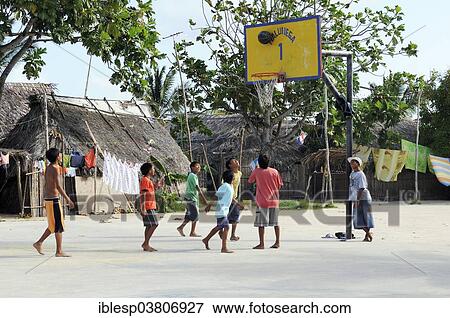 "Children play basketball in a Kuna Indian village, Nalunega, San Blas Islands, Panama, North America" View Large Photo Image Stock Photo - "Children play basketball in a Kuna Indian village, Nalunega, San Blas Islands, Panama, North America". Fotosearch