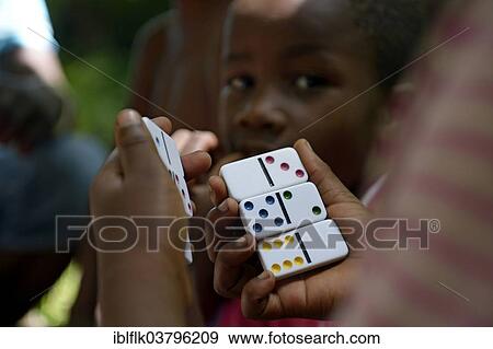 "Children playing dominoes, Tchawa, Leogane, Haiti, North America" View Large Photo Image Stock Photo - "Children playing dominoes, Tchawa, Leogane, Haiti, North America". Fotosearch