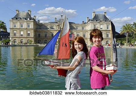 "Children playing with ships at the pond of the Palais du Luxembourg, Jardin du Luxembourg, 6th Arrondissement Latin Quarter, Paris, France, Europe" View Large Photo Image Stock Image - "Children playing with ships at the pond of the Palais du Luxembourg, Jardin du Luxembourg, 6th Arrondissement Latin Quarter, Paris, France, Europe". Fotosearch