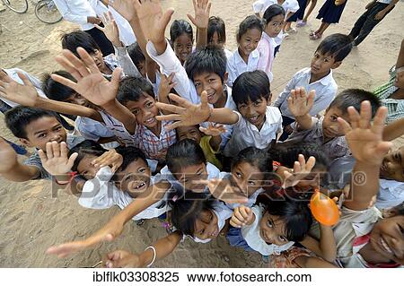 "Children stretching their arms up, bird's eye view, Lompong Village, Bathi District, Takeo Province, Cambodia, Asia" View Large Photo Image Stock Photography - "Children stretching their arms up, bird's eye view, Lompong Village, Bathi District, Takeo Province, Cambodia, Asia". Fotosearch