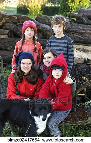 Picture - Children with a Border Collie, Othenstorf, Mecklenburg-Western Pomerania, Germany, Europe. Fotosearch