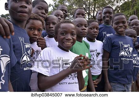 "Children with flying fox T-shirts at an observation of palm fruit bats (Eidolon helvum) Kasanka National Park, Zambia, Africa" View Large Photo Image Stock Photo - "Children with flying fox T-shirts at an observation of palm fruit bats (Eidolon helvum) Kasanka National Park, Zambia, Africa". Fotosearch