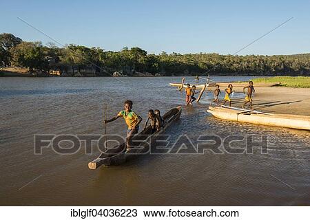 "Children with pirogue or dugout, on the river Manambolo, Bekopaka Manambolo, Madagascar, Africa" View Large Photo Image Stock Image - "Children with pirogue or dugout, on the river Manambolo, Bekopaka Manambolo, Madagascar, Africa". Fotosearch