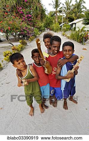 "Children with ukulele toys, Arborek, Raja Ampat, West Papua, Indonesia, Asia" View Large Photo Image Stock Photo - "Children with ukulele toys, Arborek, Raja Ampat, West Papua, Indonesia, Asia". Fotosearch