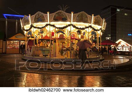 Stock Image - "Children's carousel at the Christmas market, Kennedyplatz square, Essen, Ruhr area, North Rhine-Westphalia, Germany, Europe, PublicGround, Europe". Fotosearch