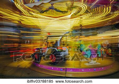 "Children's carousel in motion, night shot, long exposure, Christmas market, Dusseldorf, North Rhine-Westphalia, Germany, Europe" View Large Photo Image Stock Photography - "Children's carousel in motion, night shot, long exposure, Christmas market, Dusseldorf, North Rhine-Westphalia, Germany, Europe". Fotosearch