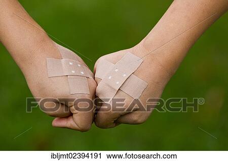 Children's hands with plaster strips View Large Photo Image Stock Image - Children's hands with plaster strips. Fotosearch
