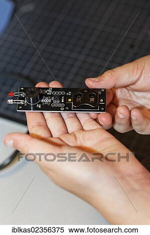 "Child's hands holding an electronic component with light emitting diodes, IdeenPark 2012, technology and education summit conference for young people, Essen, Ruhr area, North Rhine-Westphalia, Germany, Europe" View Large Photo Image Stock Photography - "Child's hands holding an electronic component with light emitting diodes, IdeenPark 2012, technology and education summit conference for young people, Essen, Ruhr area, North Rhine-Westphalia, Germany, Europe". Fotosearch