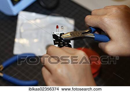 "Child's hands using pliers on an electronic component with light emitting diodes, IdeenPark 2012, technology and education summit conference for young people, Essen, Ruhr area, North Rhine-Westphalia, Germany, Europe" View Large Photo Image Picture - "Child's hands using pliers on an electronic component with light emitting diodes, IdeenPark 2012, technology and education summit conference for young people, Essen, Ruhr area, North Rhine-Westphalia, Germany, Europe". Fotosearch