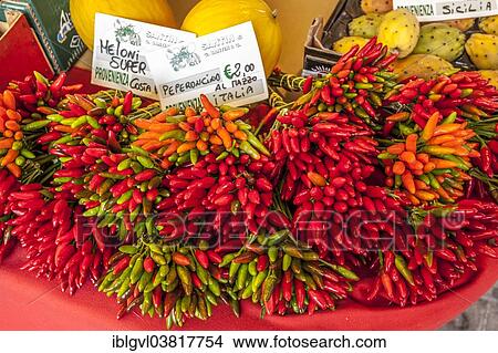 Picture - "Chili peppers at a market stall, Campo della Pescaria, Venice, Italy, Europe". Fotosearch