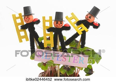 Stock Image - Chimneysweep figurines as lucky charms for the new year. Fotosearch