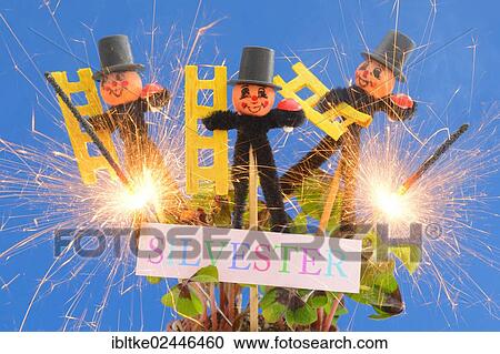 Stock Image - Chimneysweep figurines as lucky charms for the new year. Fotosearch