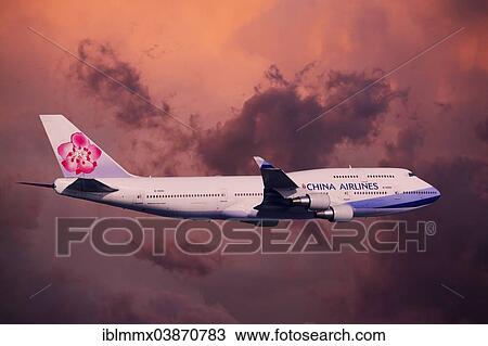 Stock Image - China Airlines Boeing 747-409 in flight during a thunderstorm. Fotosearch