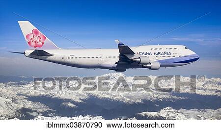 Stock Image - "China Airlines Boeing 747-409 in flight over the Alps, Switzerland, Europe". Fotosearch