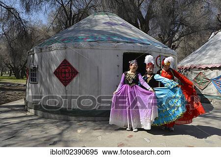 "Chinese minority tourism, Chinese tourist group dressing up in a wooded area in front of a Kazakh yurt in the traditional costume of the Kazakh minority, Heaven Lake, Tian Chi, Tian Shan, Tien Shan, Urumqi, Xinjiang, China, Asia" View Large Photo Image Stock Photography - "Chinese minority tourism, Chinese tourist group dressing up in a wooded area in front of a Kazakh yurt in the traditional costume of the Kazakh minority, Heaven Lake, Tian Chi, Tian Shan, Tien Shan, Urumqi, Xinjiang, China, Asia". Fotosearch