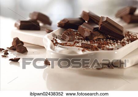 Chocolate being grated for cooking View Large Photo Image Stock Image - Chocolate being grated for cooking. Fotosearch