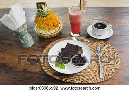 "Chocolate cake and coffee, watermelon juice, Ubud, Bali, Indonesia, Asia" View Large Photo Image Stock Image - "Chocolate cake and coffee, watermelon juice, Ubud, Bali, Indonesia, Asia". Fotosearch