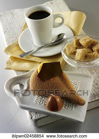 "Chocolate cake with a sponge case and chocolate filling, covered with cocoa powder" View Large Photo Image Picture - "Chocolate cake with a sponge case and chocolate filling, covered with cocoa powder". Fotosearch