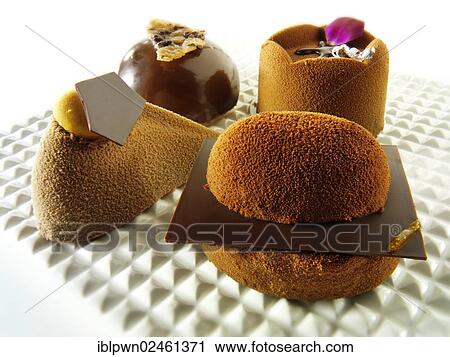"Chocolate cakes with a sponge case and chocolate filling, covered with cocoa powder" View Large Photo Image Stock Image - "Chocolate cakes with a sponge case and chocolate filling, covered with cocoa powder". Fotosearch