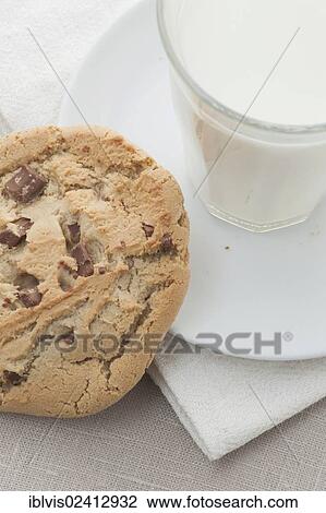 Chocolate chip cookie and a glass of milk View Large Photo Image Stock Image - Chocolate chip cookie and a glass of milk. Fotosearch