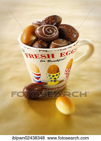 Stock Photo - Chocolate Easter eggs in a mug. Fotosearch