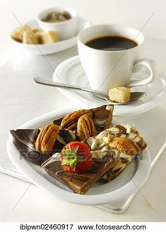 Stock Photo - Chocolate swirl biscuits and a cup of coffee. Fotosearch