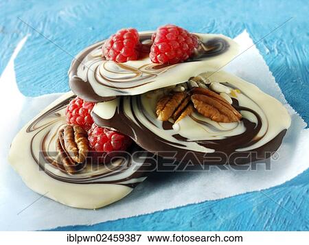 Chocolate swirl biscuits with nuts and raspberries View Large Photo Image Stock Photo - Chocolate swirl biscuits with nuts and raspberries. Fotosearch
