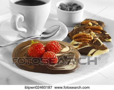 Chocolate swirl biscuits with nuts and fruit and coffee View Large Photo Image Stock Photo - Chocolate swirl biscuits with nuts and fruit and coffee. Fotosearch
