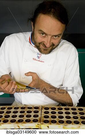 "Chocolatier Patrick Roger producing """"honey chocolates"""", """"la Ganache au Miel du Jardin"""", Sceaux/Paris, Paris, Ile-de-France, France, Europe" View Large Photo Image Stock Image - "Chocolatier Patrick Roger producing """"honey chocolates"""", """"la Ganache au Miel du Jardin"""", Sceaux/Paris, Paris, Ile-de-France, France, Europe". Fotosearch
