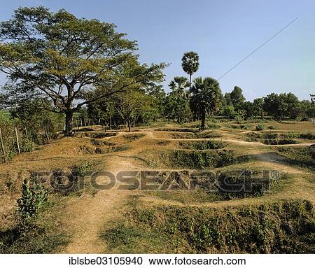 "Choeung Ek, mass graves at the Killing Fields, victims of the Pol Pot regime and the Khmer Rouge, Choeung Ek, Phnom Penh, Phnom Penh Province, Cambodia, Asia" View Large Photo Image Stock Image - "Choeung Ek, mass graves at the Killing Fields, victims of the Pol Pot regime and the Khmer Rouge, Choeung Ek, Phnom Penh, Phnom Penh Province, Cambodia, Asia". Fotosearch