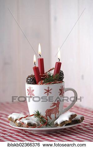 Christmas ambience with a tea cup and burning candles View Large Photo Image Stock Photograph - Christmas ambience with a tea cup and burning candles. Fotosearch