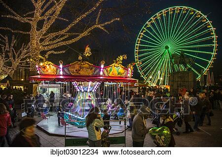 "Christmas fair, ferris wheel and carousel on Burgplatz square, Kettwiger Strasse, pedestrian area in the centre of Essen, Essen, North Rhine-Westphalia, Germany, Europe" View Large Photo Image Picture - "Christmas fair, ferris wheel and carousel on Burgplatz square, Kettwiger Strasse, pedestrian area in the centre of Essen, Essen, North Rhine-Westphalia, Germany, Europe". Fotosearch