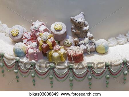 "Christmas gifts and a teddy bear made of marzipan, decoration on a cake, Dusseldorf, North Rhine-Westphalia, Germany, Europe" View Large Photo Image Stock Photo - "Christmas gifts and a teddy bear made of marzipan, decoration on a cake, Dusseldorf, North Rhine-Westphalia, Germany, Europe". Fotosearch