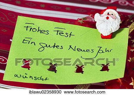 Stock Image - "Christmas greeting card, Frohes Fest, Ein gutes neues Jahr, German for Merry Christmas, Happy New Year". Fotosearch