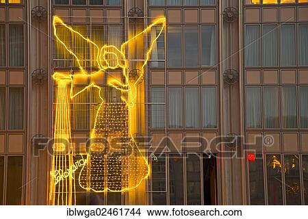 Picture - "Christmas market at Cologne Cathedral, Christmas decorations, angel on the 4711 Blue-Gold-House, Cathedral Square, Cologne, North Rhine-Westphalia, Germany, Europe, PublicGround, Europe". Fotosearch