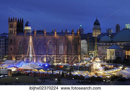 Picture - "Christmas market at Opera Palais with the Friedrichswerderscher Church and domes of a French Cathedral and German Cathedral on Gendarmenmarkt square, high-rise buildings from the Sony Center, Berlin Mitte, Berlin, Germany, Europe". Fotosearch