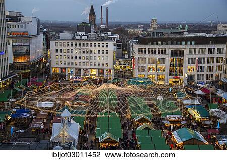 Stock Image - "Christmas market on Kennedyplatz square, downtown Essen, Essen, North Rhine-Westphalia, Germany, Europe". Fotosearch