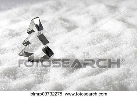 Christmas tree cookie cutter in the snow View Large Photo Image Stock Photography - Christmas tree cookie cutter in the snow. Fotosearch